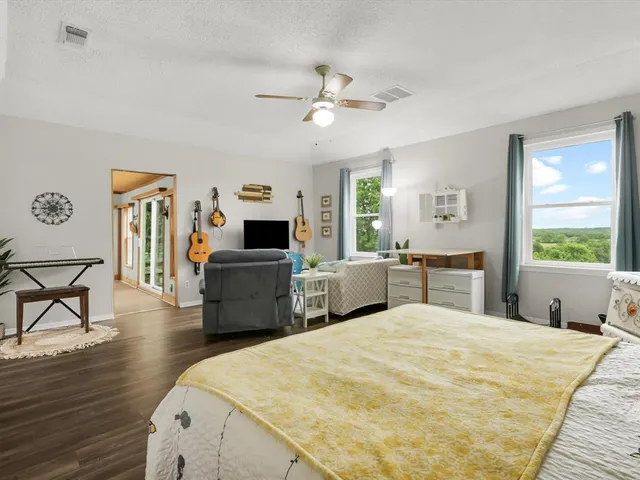 a bathroom with a granite countertop sink a mirror and vanity