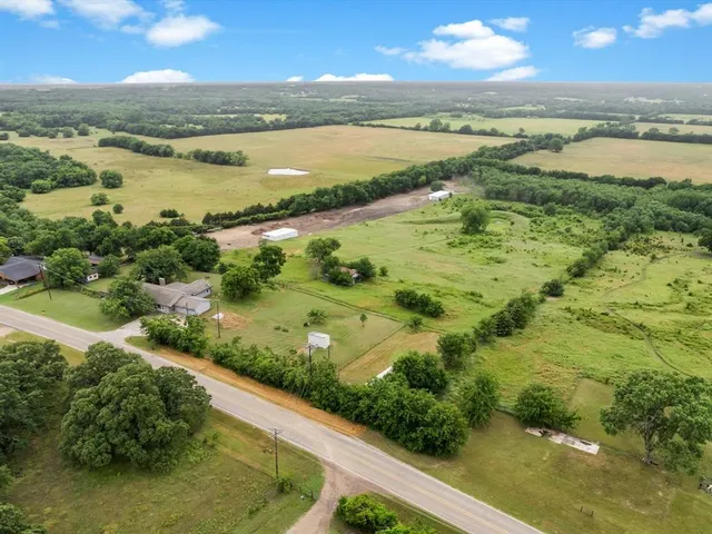 an aerial view of residential building with outdoor space and lake view