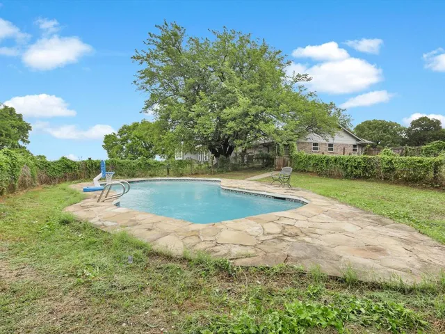 a view of lawn chairs and yard