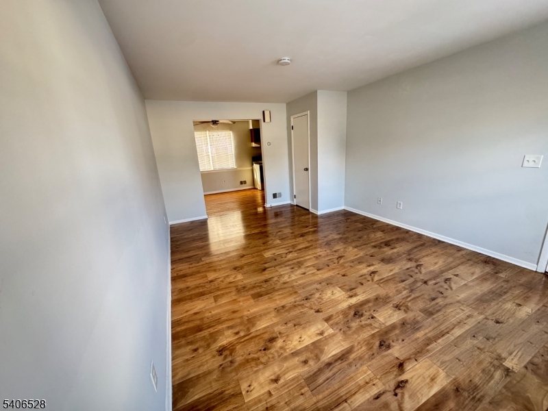 15 Hanover Square, Unit C Middlesex, NJ 08846 - Photo 3 of 12 a view of empty room with wooden floor