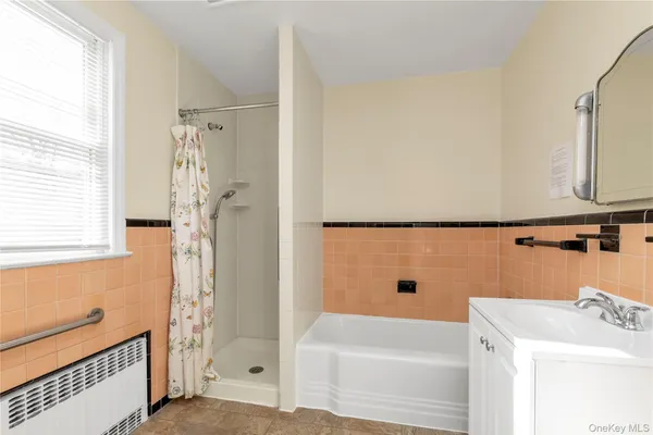 a bathroom with a bathtub and a sink