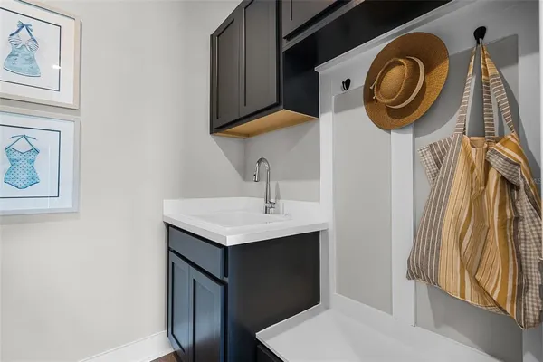 a bathroom with a sink a mirror and vanity