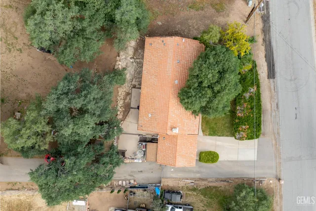 an aerial view of a house with outdoor space