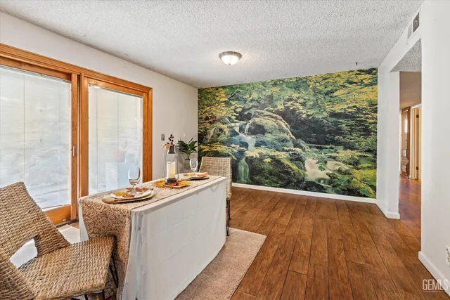 a room with wooden floor and furniture