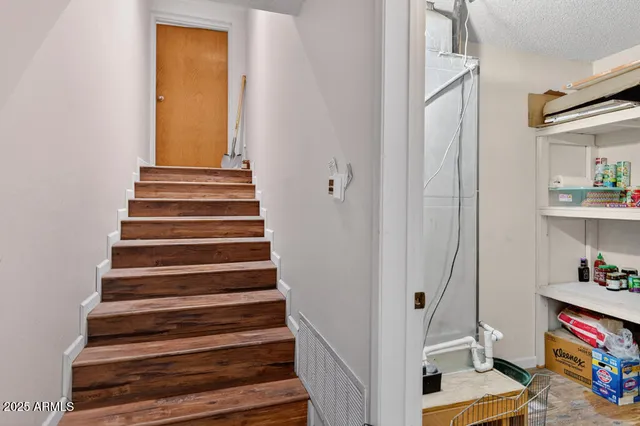 a bedroom with bed and a closet