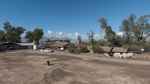 an aerial view of a house with outdoor space