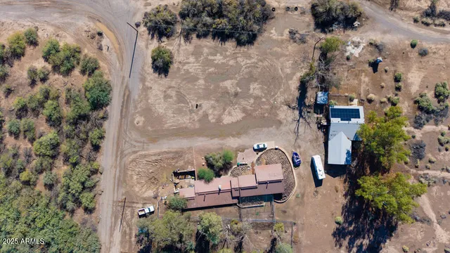 a couple of cars parked in front of a house