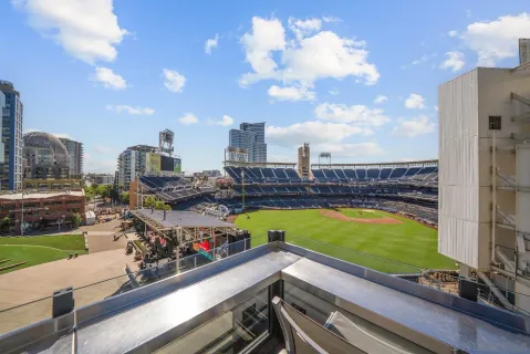 a view of a swimming pool with a lawn chairs and a yard