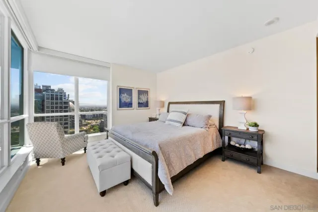 a bedroom with a bed and a couch