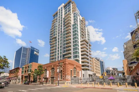 a view of a tall building next to a road