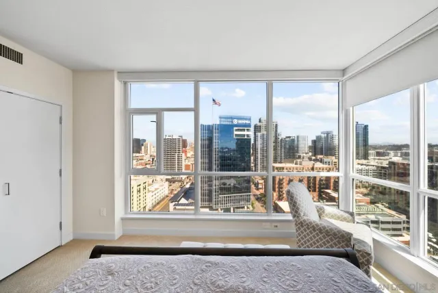 a living room with a large window and a table