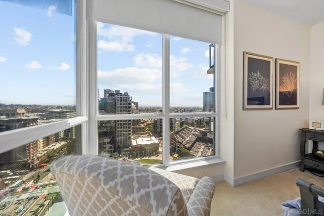 a living room with a large window and a table