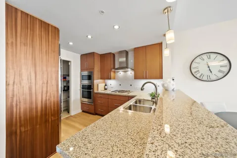 a very nice looking kitchen with a large window