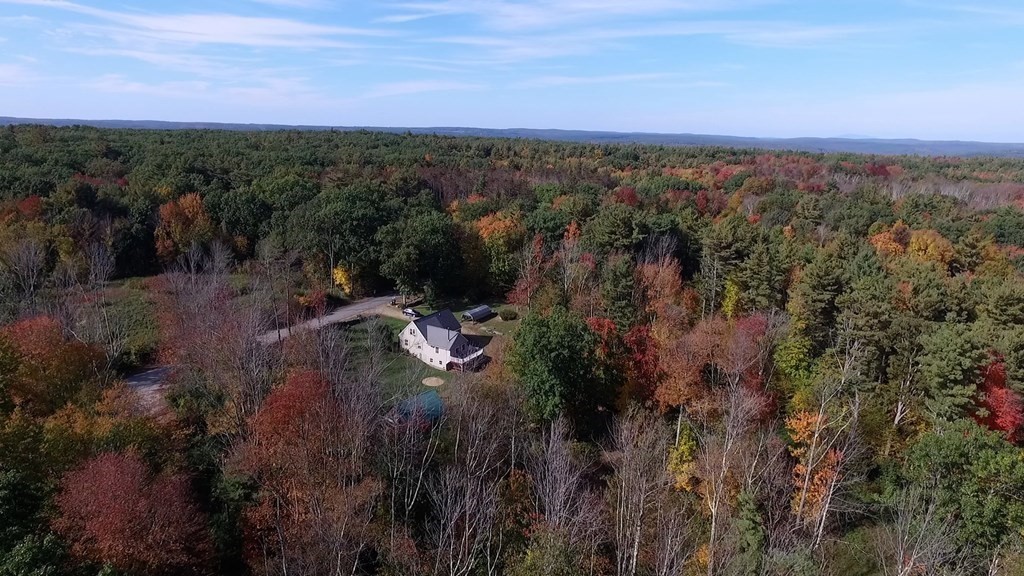 360 Coldbrook Road Oakham, MA 01068 - Photo 25 of 28 a view of a city with lush green forest
