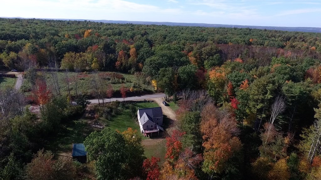 360 Coldbrook Road Oakham, MA 01068 - Photo 28 of 28 an aerial view of residential house with outdoor space
