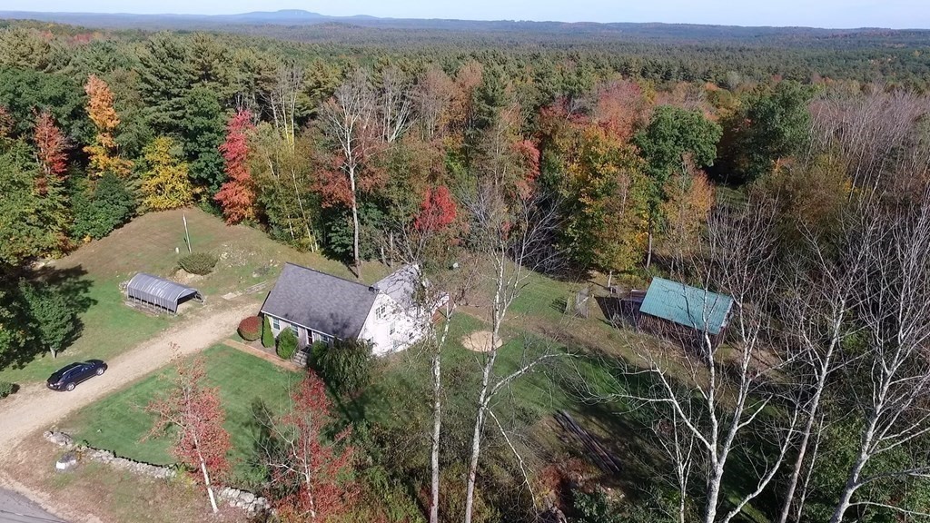 360 Coldbrook Road Oakham, MA 01068 - Photo 5 of 28 an aerial view of a house with a yard