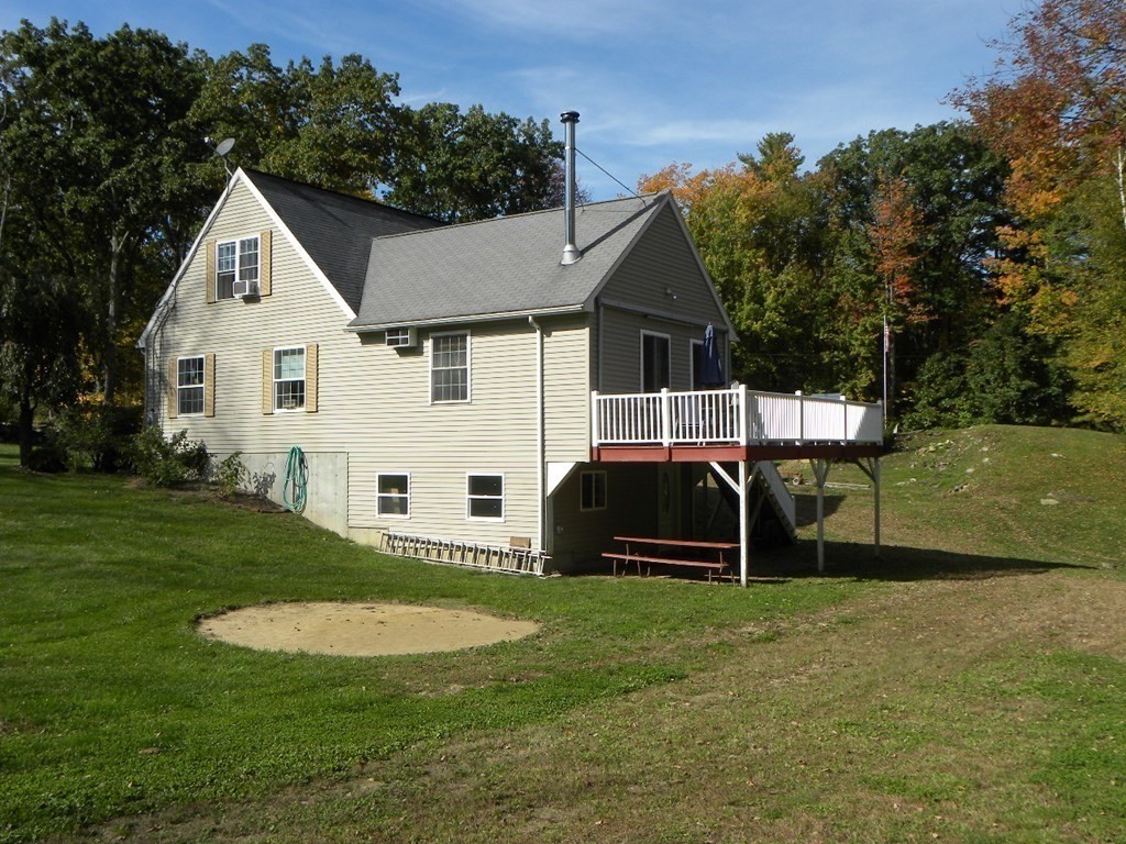 360 Coldbrook Road Oakham, MA 01068 - Photo 7 of 28 a front view of a house with a yard