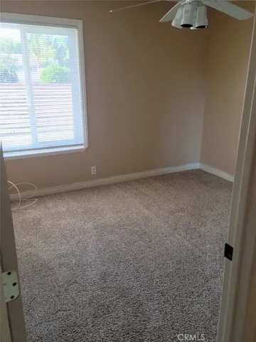 a view of a livingroom and a window