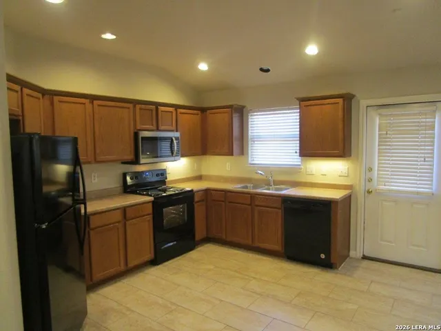 a view of a hallway with two chairs