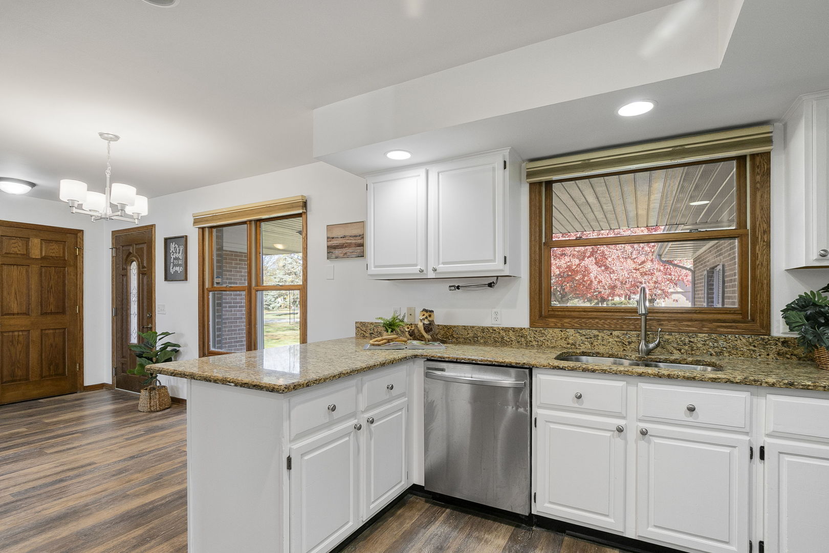 10201 Fox Bluff Lane Spring Grove, IL 60081 - Photo 7 of 26 a kitchen with granite countertop a sink window and cabinets