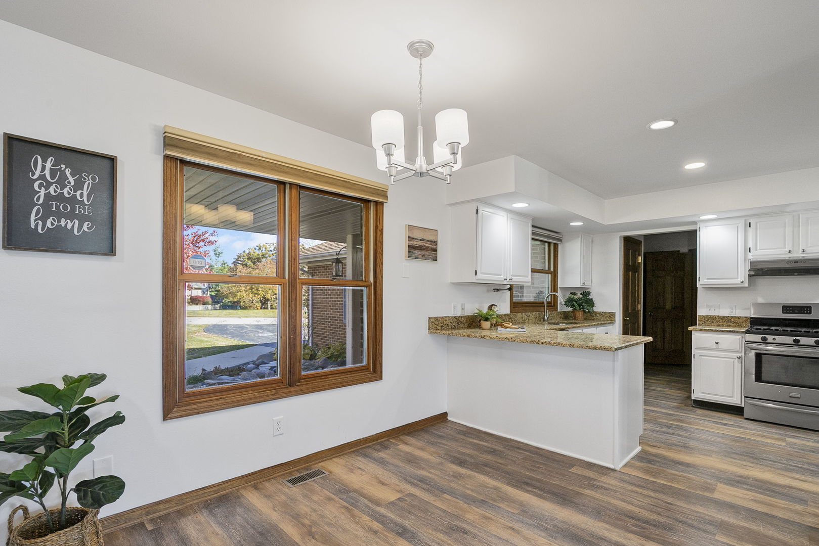 10201 Fox Bluff Lane Spring Grove, IL 60081 - Photo 8 of 26 a kitchen with stainless steel appliances granite countertop a stove and a refrigerator