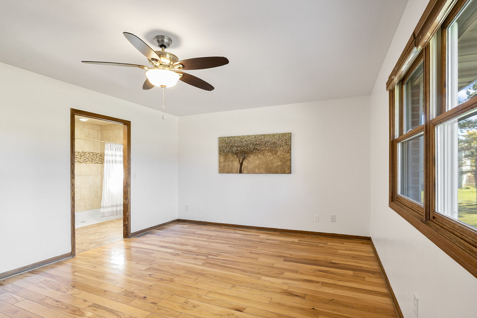 10201 Fox Bluff Lane Spring Grove, IL 60081 - Photo 10 of 26 a view of empty room with wooden floor and fan