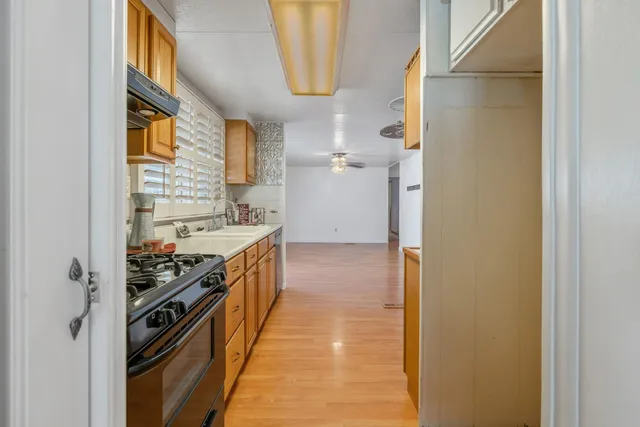 a kitchen with a sink and a stove