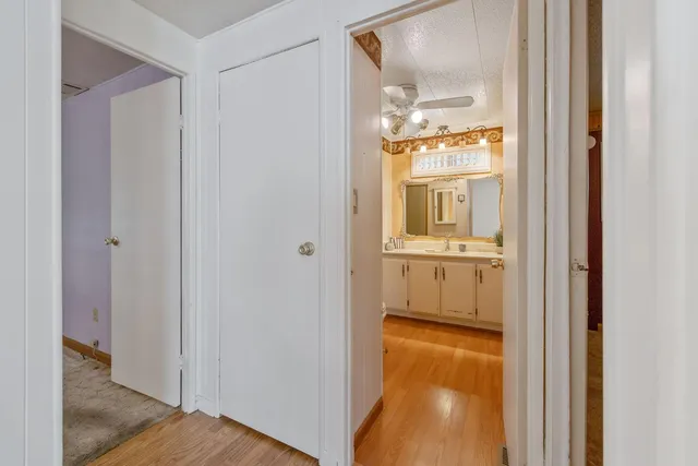 a view of a bathroom from a hallway