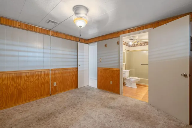 a view of a room with a barbeque and wooden floor