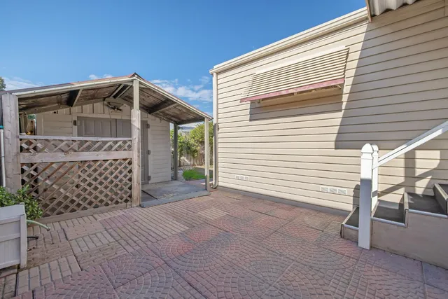 a front view of a house with a large window