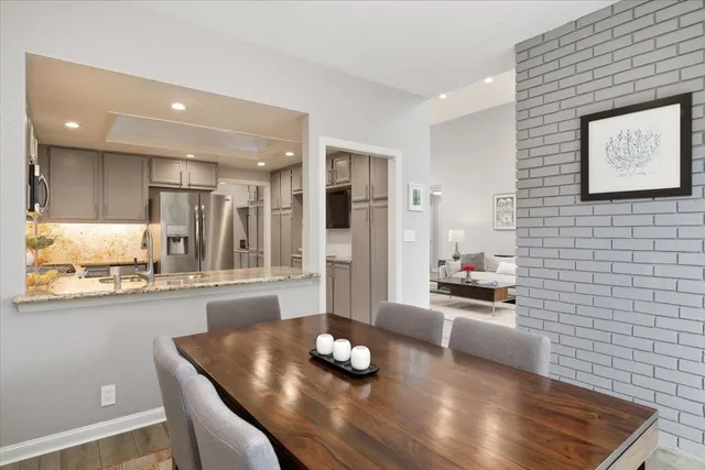 a kitchen with granite countertop a sink and cabinets