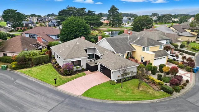 an aerial view of a house with a garden