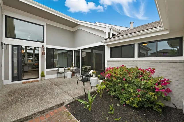 a flower plants in front of a house