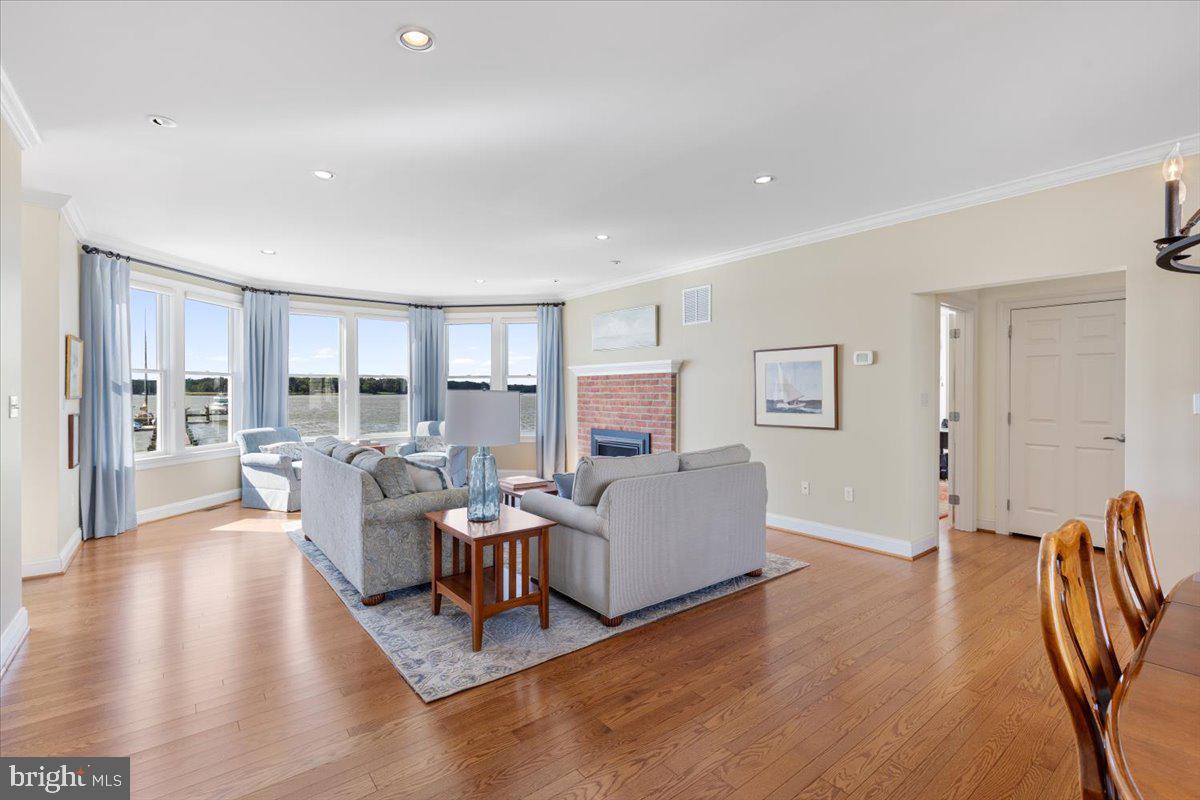 1100 Steamboat Road Shady Side, MD 20764 - Photo 19 of 81 a living room with furniture and a wooden floor