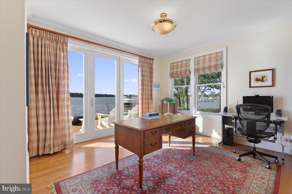 1100 Steamboat Road Shady Side, MD 20764 - Photo 24 of 81 a view of a workspace with furniture and a window