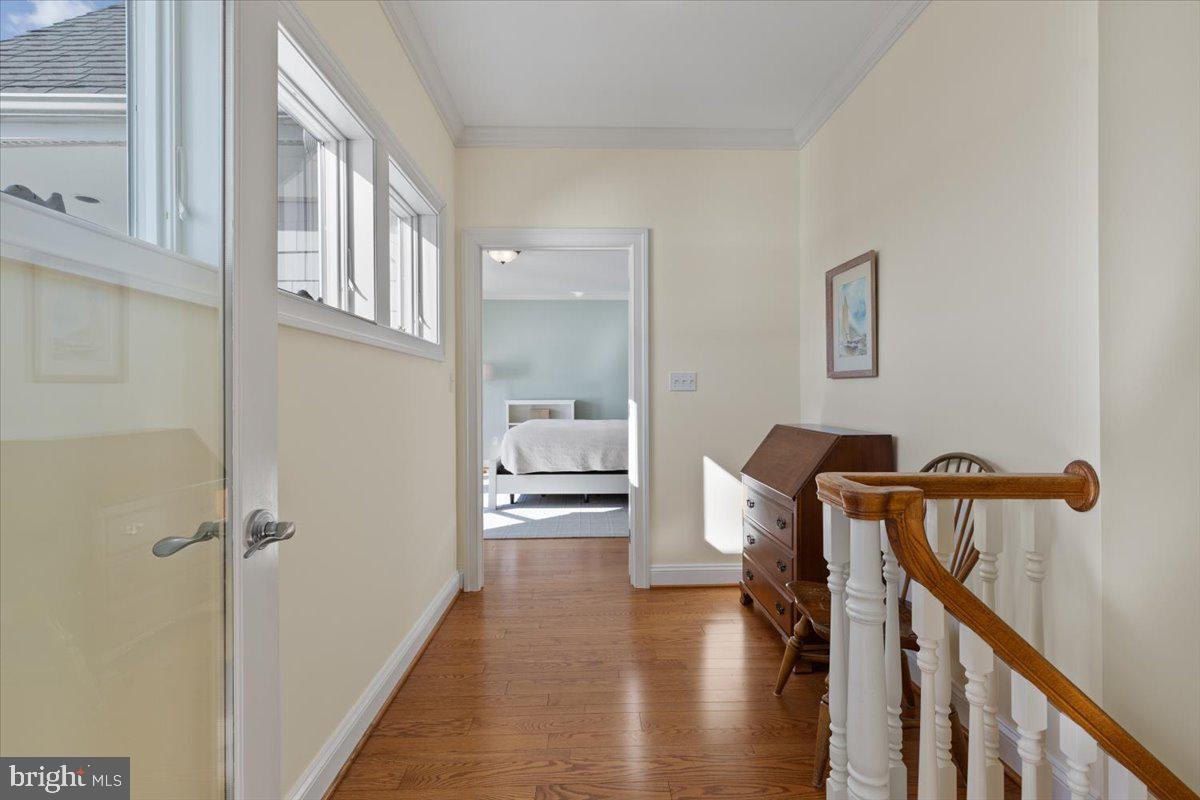 1100 Steamboat Road Shady Side, MD 20764 - Photo 29 of 81 a view of a hallway with furniture and wooden floor