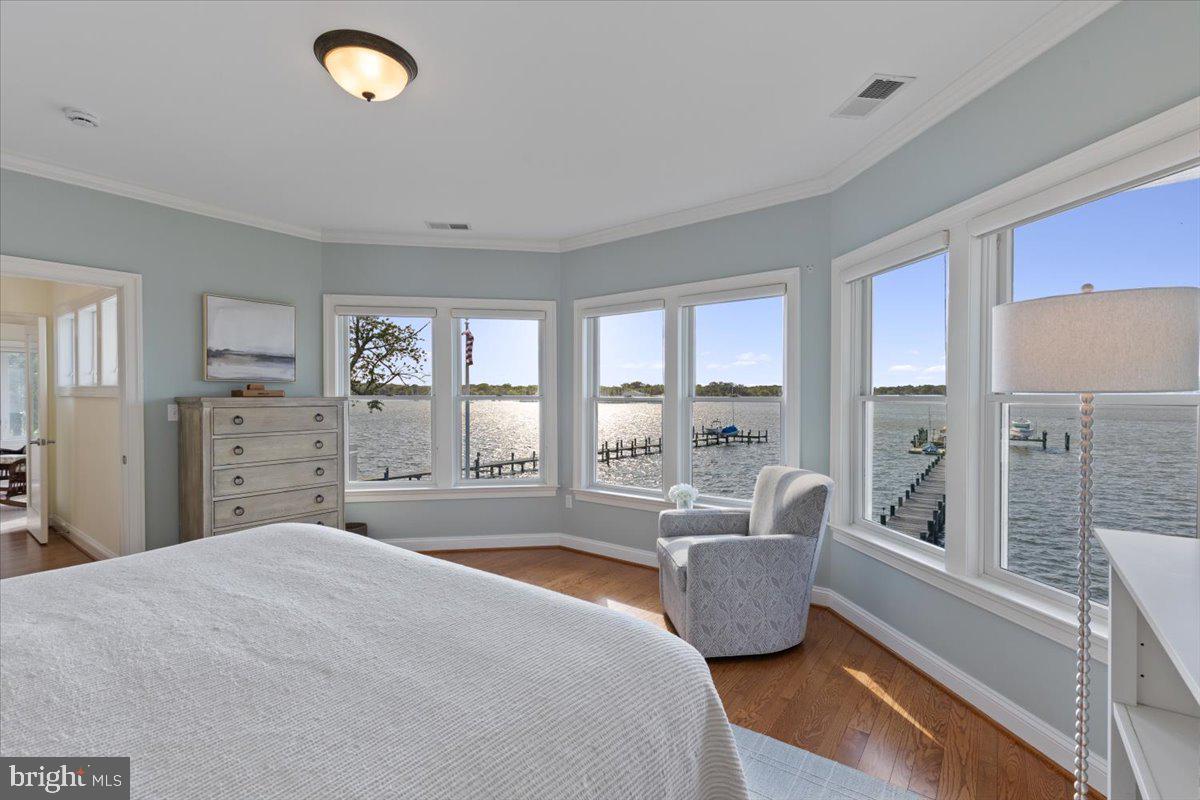 1100 Steamboat Road Shady Side, MD 20764 - Photo 32 of 81 a bedroom with a large bed and a large window