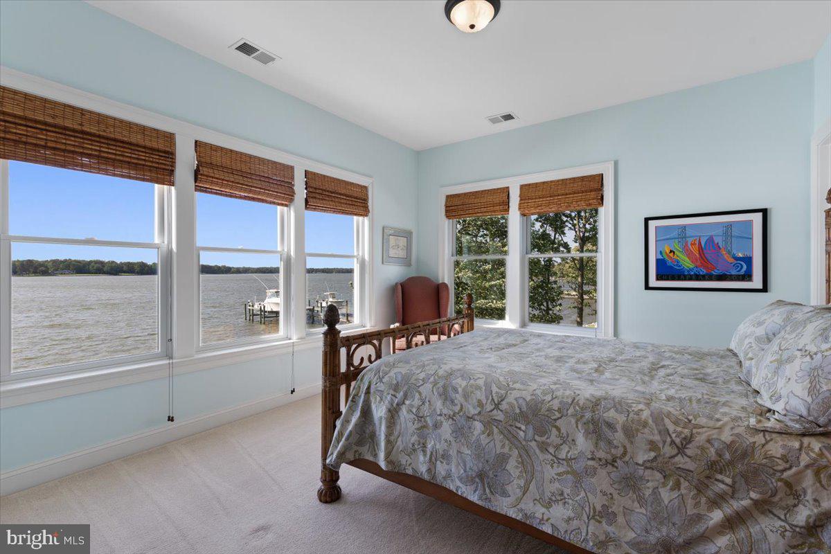 1100 Steamboat Road Shady Side, MD 20764 - Photo 48 of 81 a bedroom with a bed and a large window