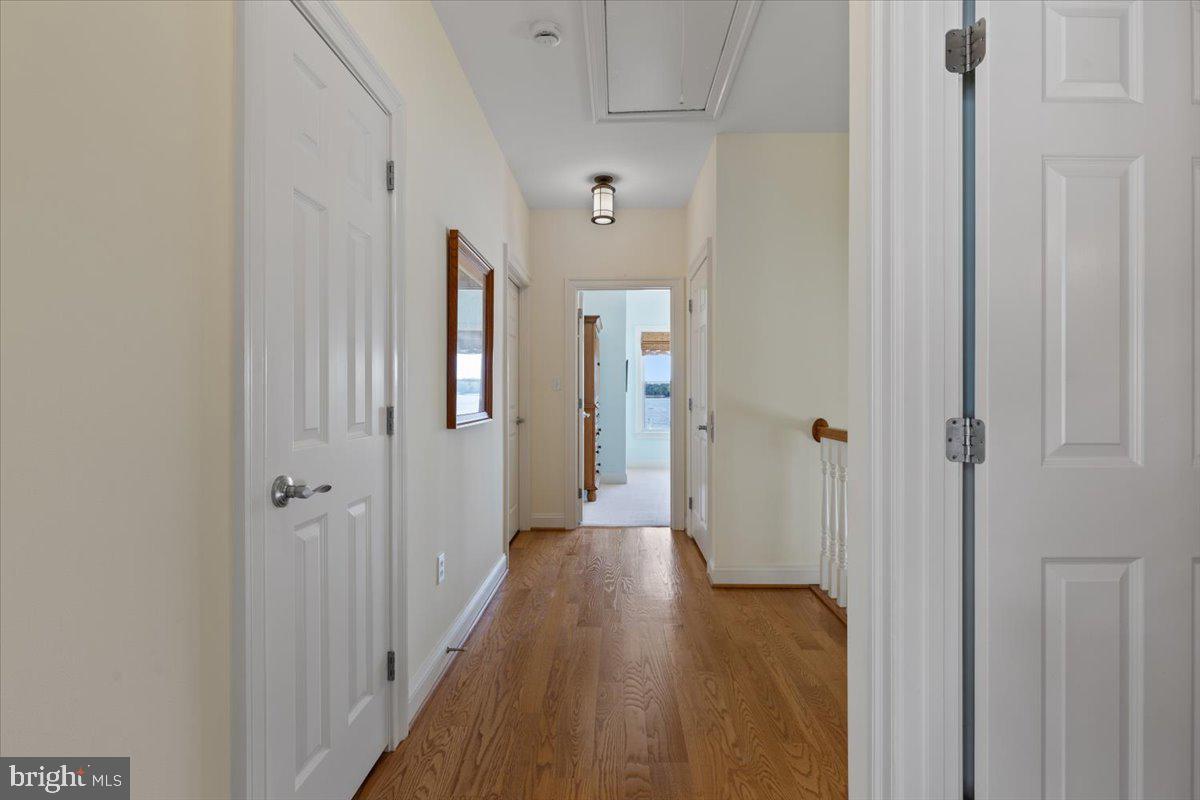 1100 Steamboat Road Shady Side, MD 20764 - Photo 51 of 81 a view of a hallway with wooden floor