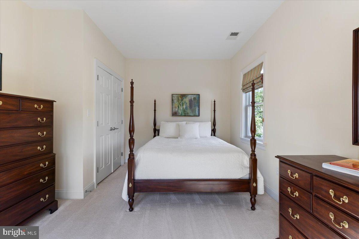 1100 Steamboat Road Shady Side, MD 20764 - Photo 54 of 81 a bedroom with a bed and a dresser