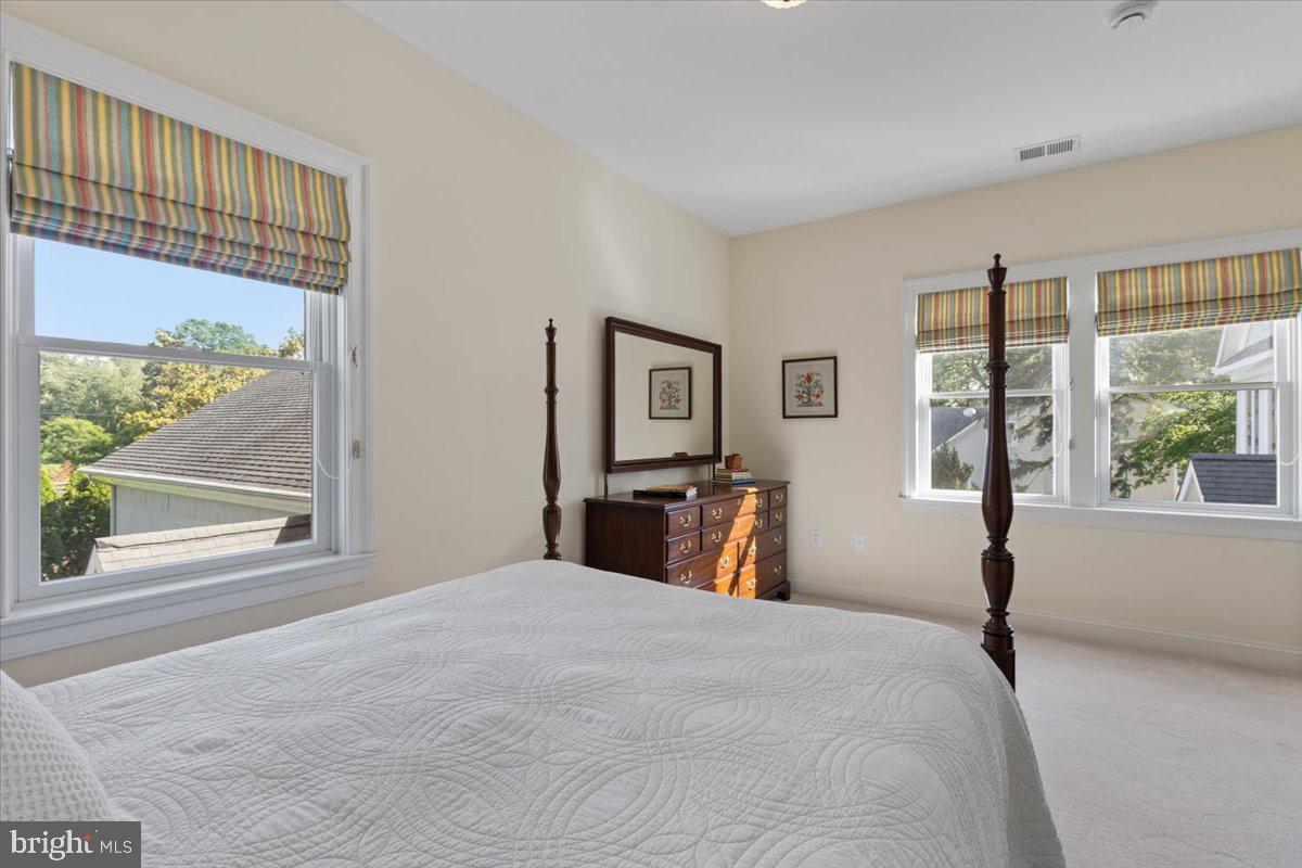 1100 Steamboat Road Shady Side, MD 20764 - Photo 55 of 81 a bedroom with a large bed and a large window