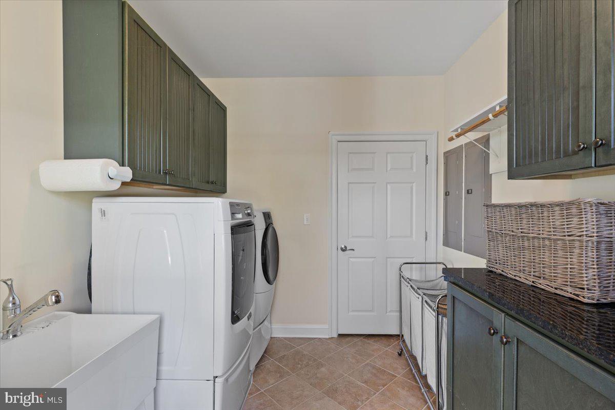 1100 Steamboat Road Shady Side, MD 20764 - Photo 58 of 81 a bathroom with a sink and a mirror