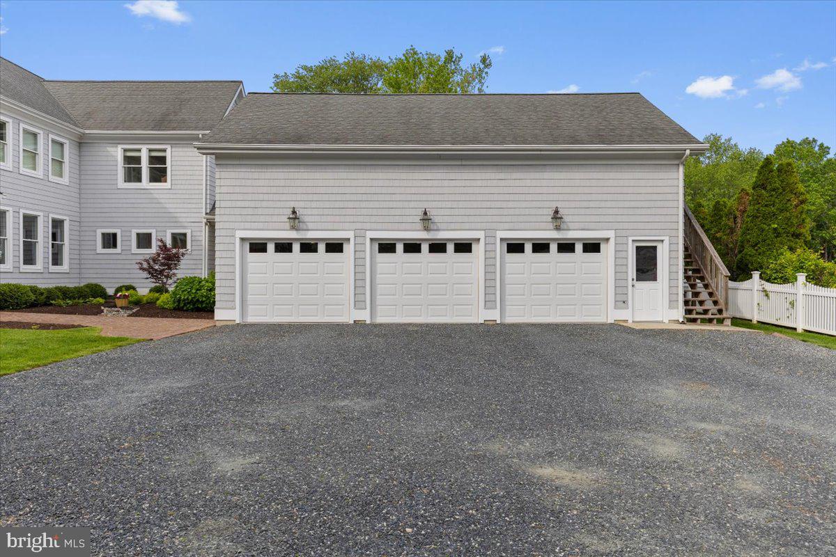 1100 Steamboat Road Shady Side, MD 20764 - Photo 68 of 81 a front view of a house with a yard and garage