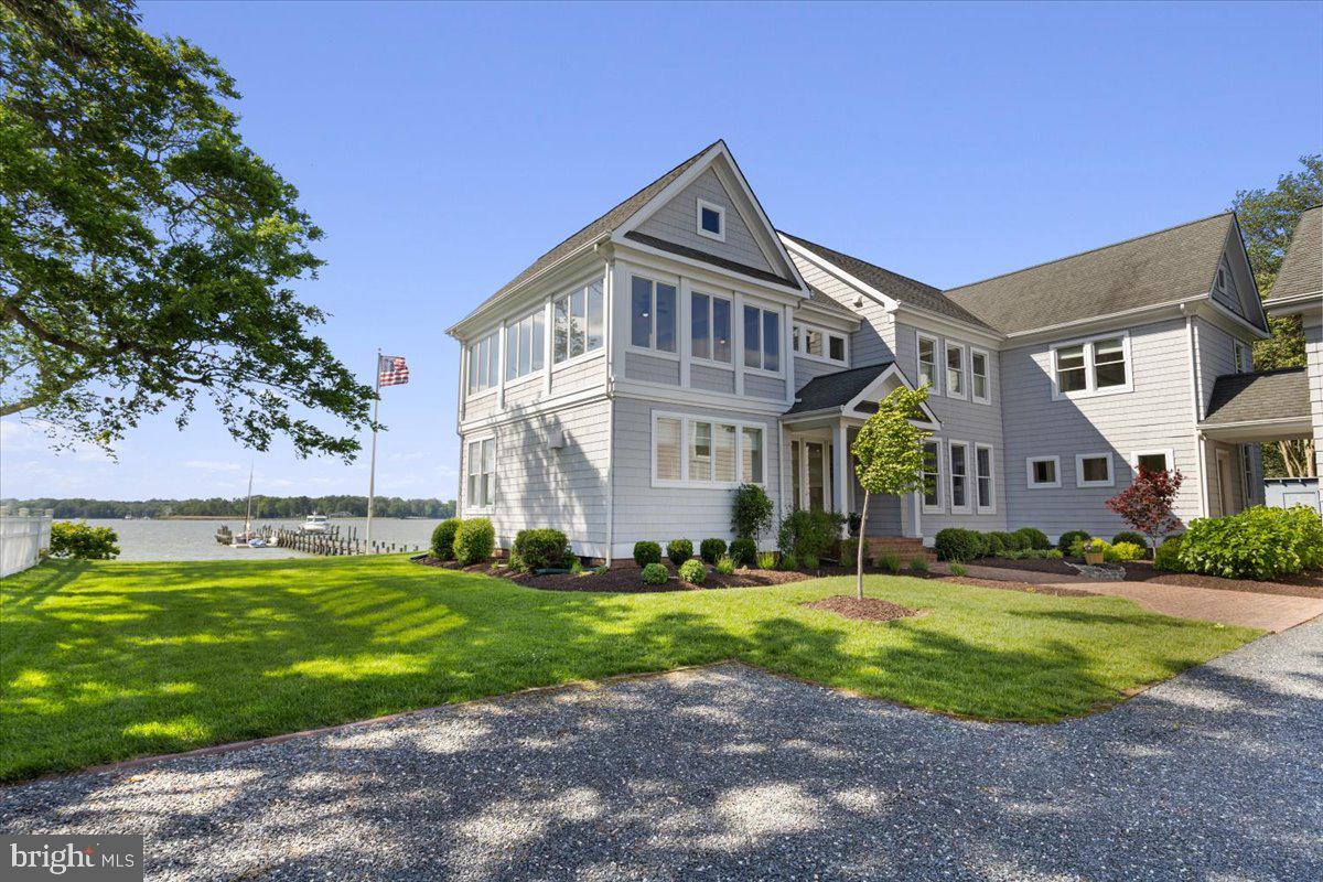 1100 Steamboat Road Shady Side, MD 20764 - Photo 7 of 81 a front view of a house with a yard