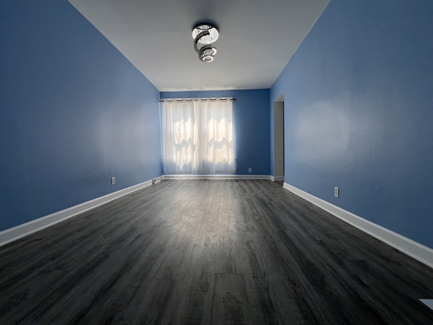 6528 South Sangamon Street Chicago, IL 60621 - Photo 4 of 14 wooden floor in an empty room with a window