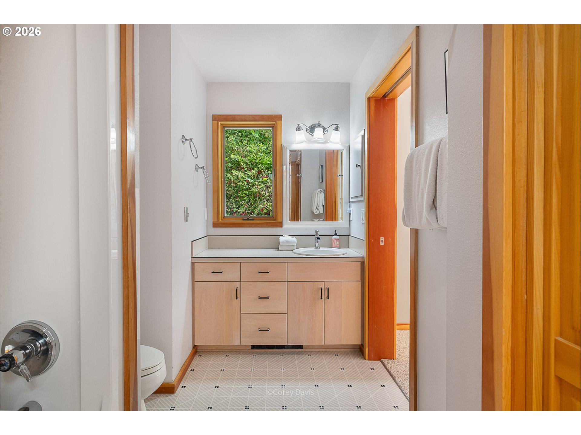 38295 Beulah Reed Road Nehalem, OR 97131 - Photo 38 of 42 a bathroom with a sink a mirror and a shower