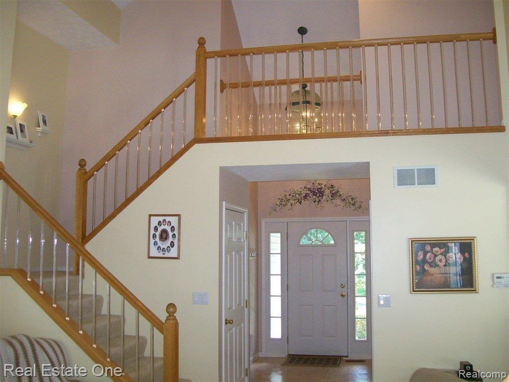 5211 7 Mile Road South Lyon, MI 48178 - Photo 6 of 25 Open staircase