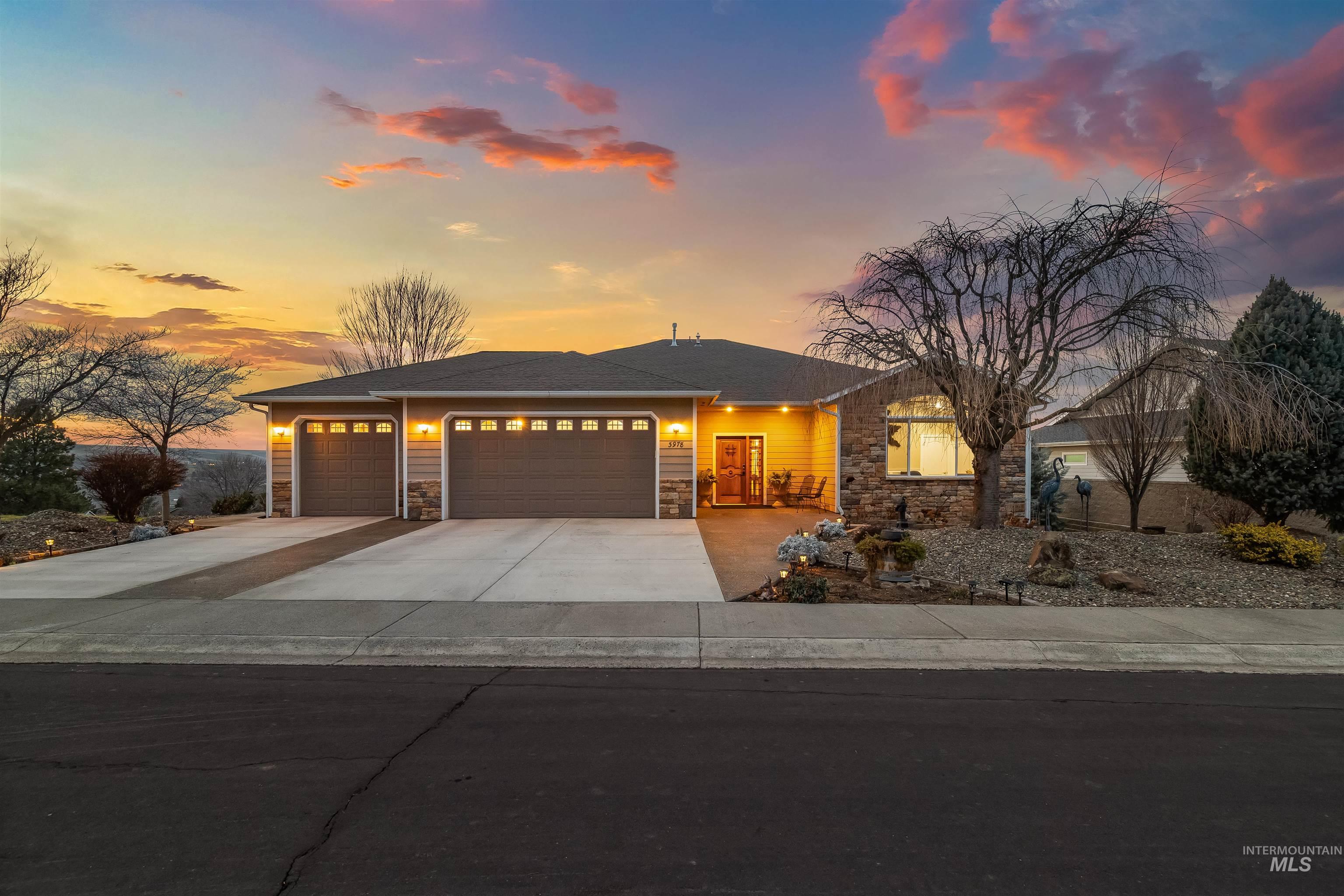 3978 Foothill Drive Lewiston, ID 83501 - Photo 2 of 40 View of front of property featuring stone siding, an attached garage, and concrete driveway