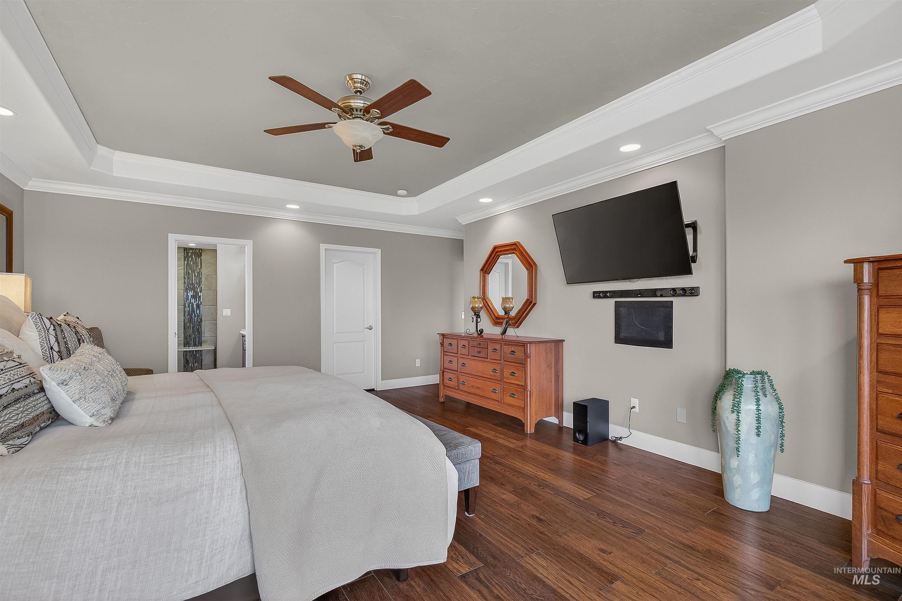 3978 Foothill Drive Lewiston, ID 83501 - Photo 21 of 40 Bedroom featuring a raised ceiling, recessed lighting, ornamental molding, a ceiling fan, and dark wood-style flooring