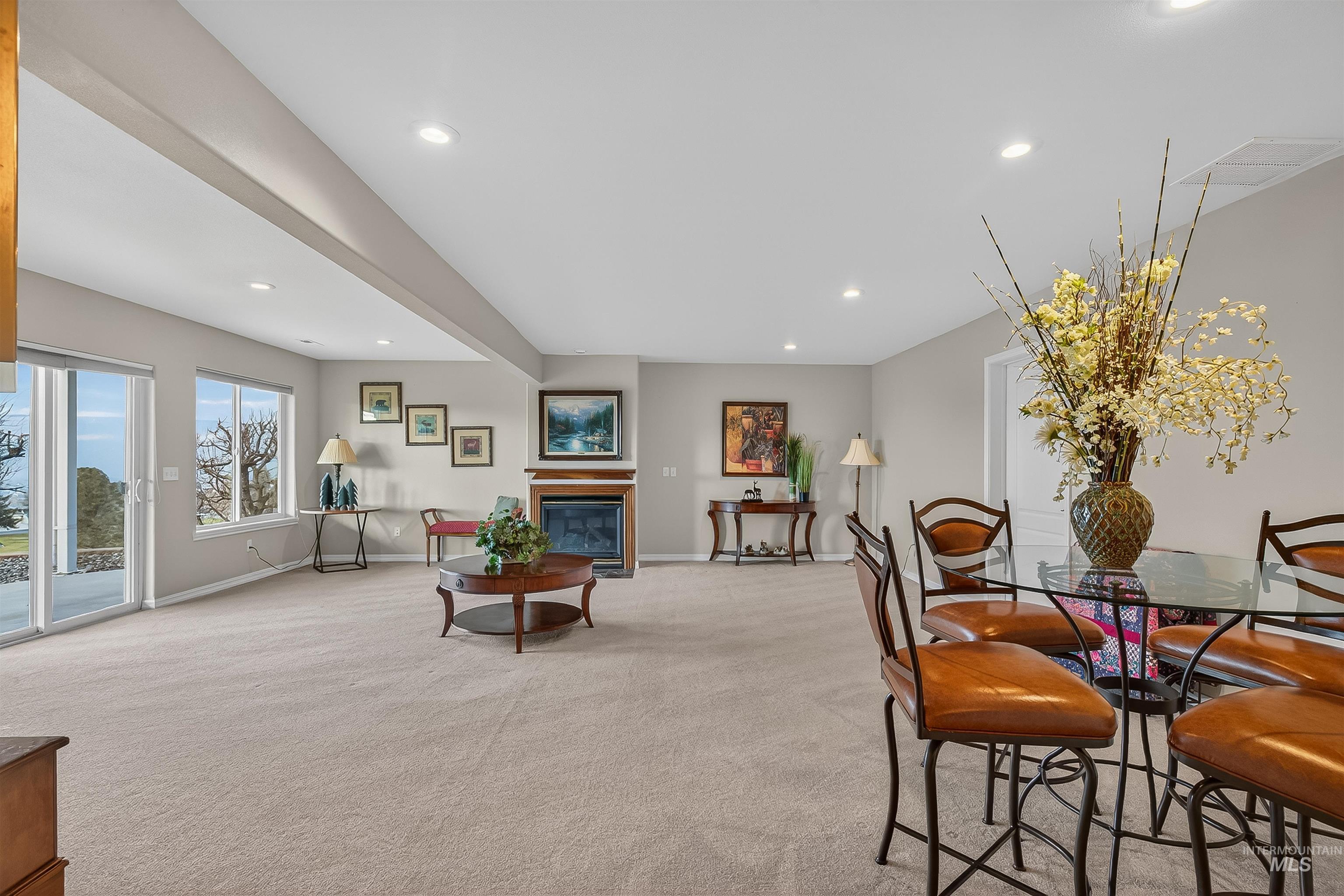 3978 Foothill Drive Lewiston, ID 83501 - Photo 29 of 40 Dining area featuring light carpet, recessed lighting, and a glass covered fireplace